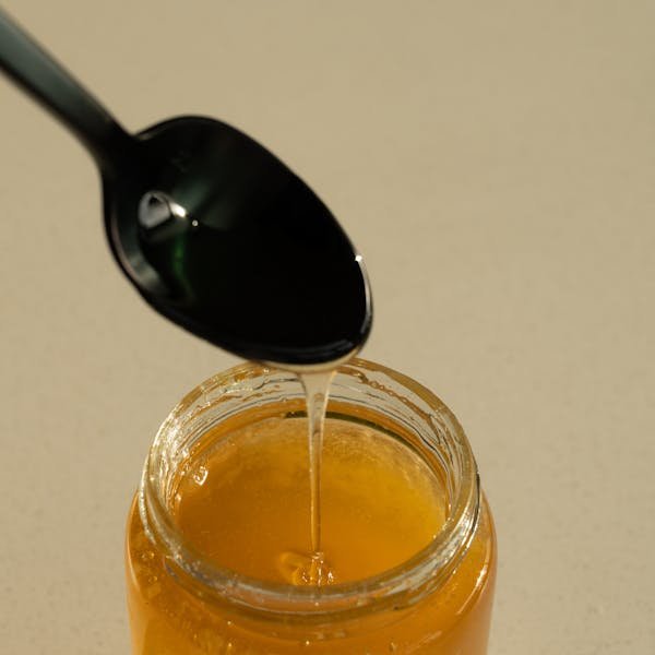 Spoon and a Jar Full of Honey